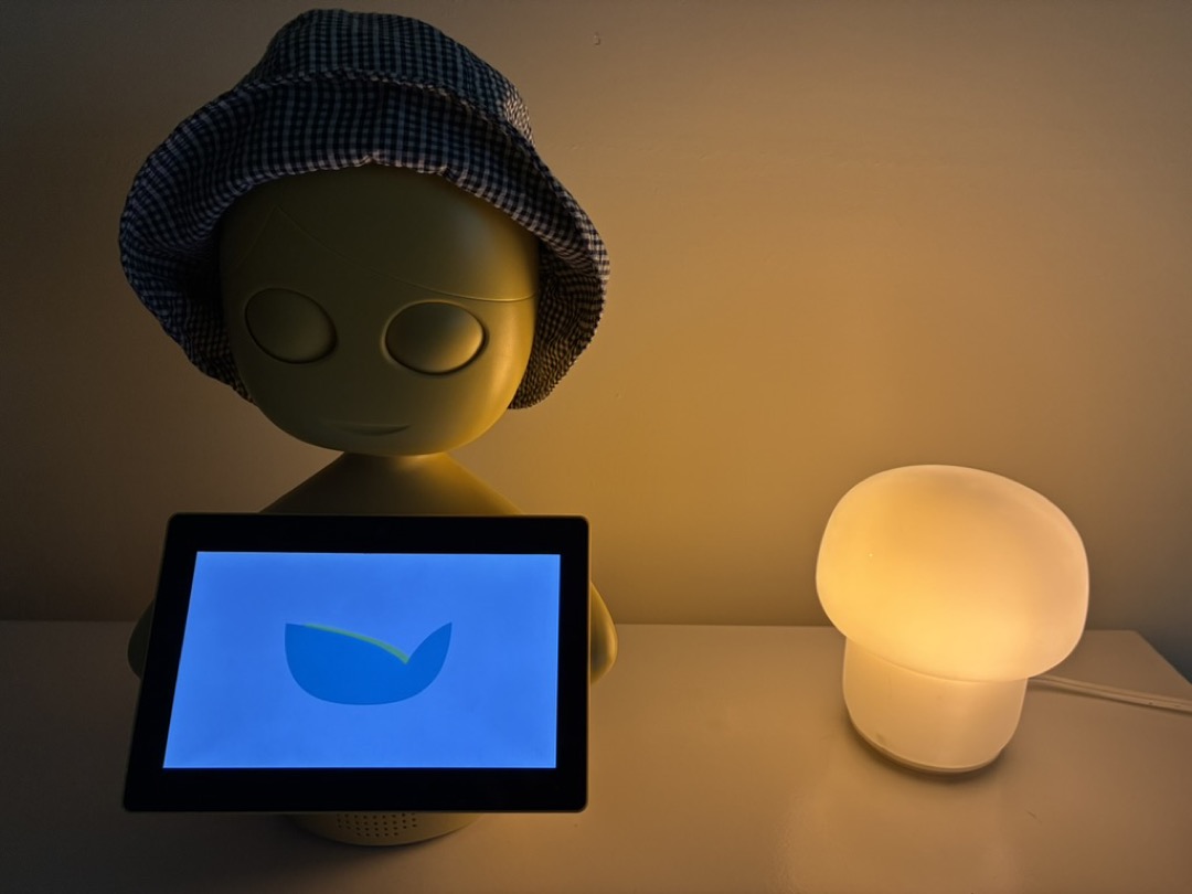 Mabu the robot on a tabletop with her lamp